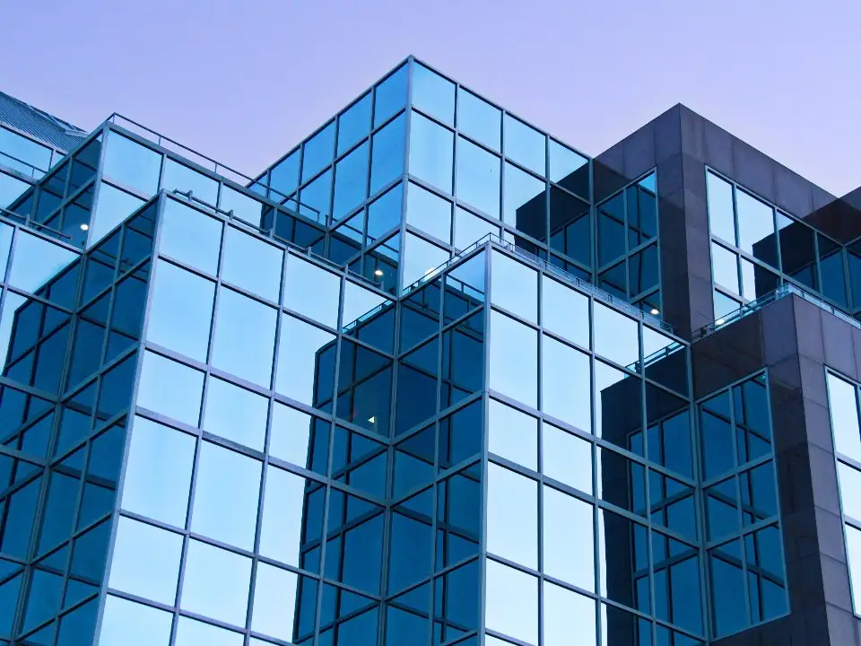 Blue glass office building, representing corporate finance and advisory