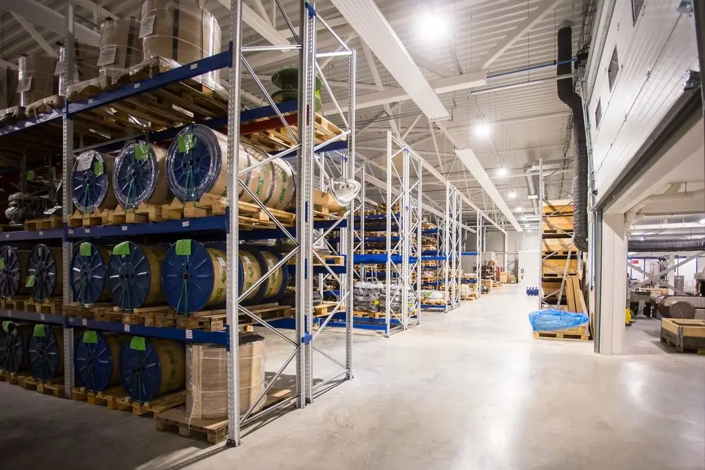 Warehouse interior with storage racks, representing working capital financing for MSMEs